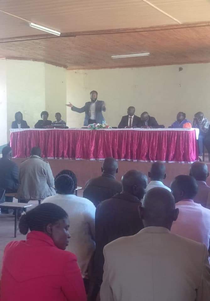 Members of the Bomet NG-CDF flag the consultants during Public participation on implementation of Policies and Strategic Plan with members of the Public.